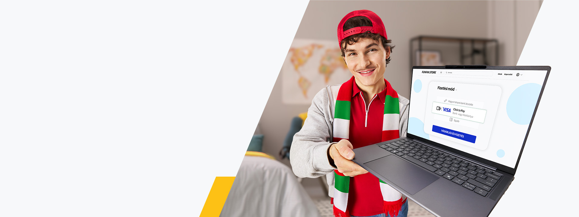 Man in red hat holding up a laptop