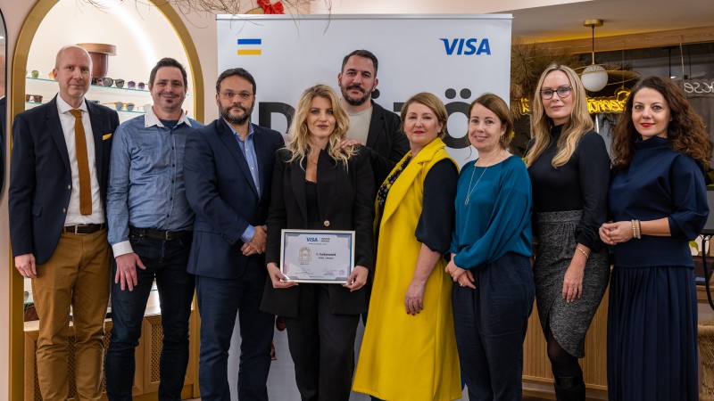 group of people posing with prize