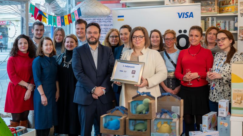group of people posing with prize